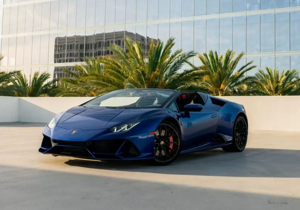 Blue Lamborghini Huracan Evo Spyder rental | Cache Luxe