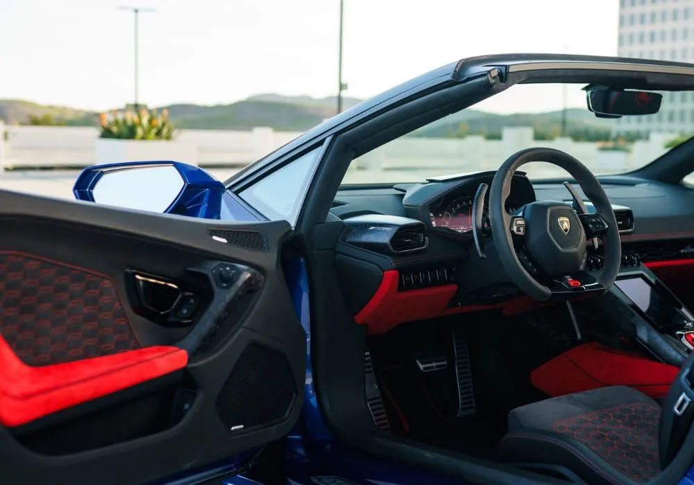 Blue Lamborghini Huracan Evo Spyder rental | Cache Luxe