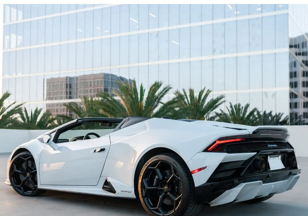 White Lamborghini Huracan Evo Spyder rental | Cache Luxe